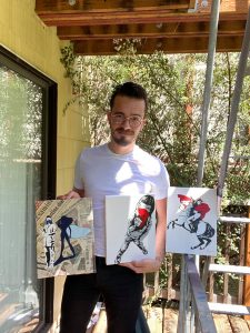 Baptiste Dubois avec ses peintures